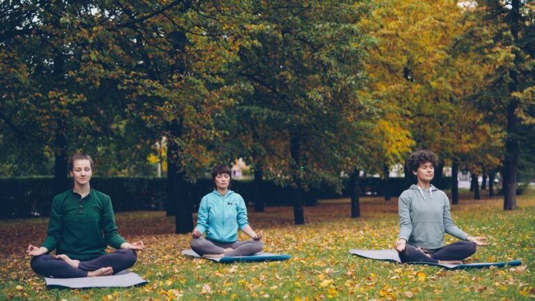 Unlock Your Well-being: How Headspace and Cigna Partner for Better Mental Health Three people meditating in a park