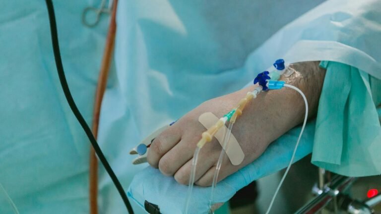 Empowering Your Well-being: An Introduction to IVC Health Solutions a person in a hospital bed with an iv