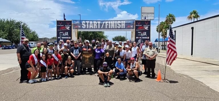 Participants and volunteers gather at the finish line for the Signal Run on June 13, 2026.