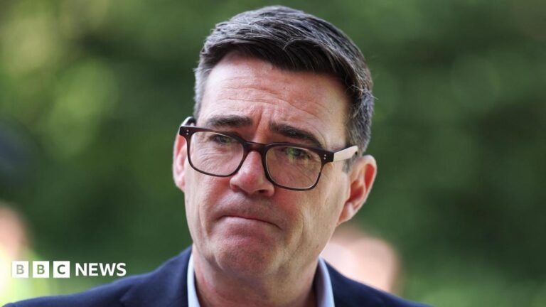 Can PM’s Gaza apology win back lost Muslim voters in Bradford? A middle aged man with dark, slightly greying hair. He is wearing a dark blue suit jacket, a white shirt and dark , squarish rimmed glasses. His lips are pursed and he has a serious look.