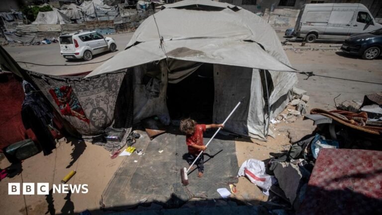 Board of Peace’s Gaza envoy criticises Israeli strikes and Hamas actions A young girl sweeps up with a brush outside a tent in Gaza City, northern Gaza (24 August 2026)