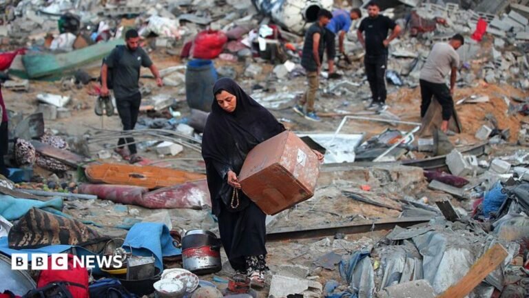A Palestinian man rests amid debris at the site of an Israeli strike on a house in Gaza City, on July 30, 2026.