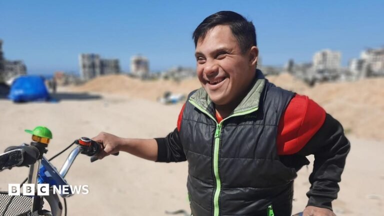 Families’ agonising search for answers as thousands still missing in Gaza Ahmed al Madhoun smiles as he holds his bike.