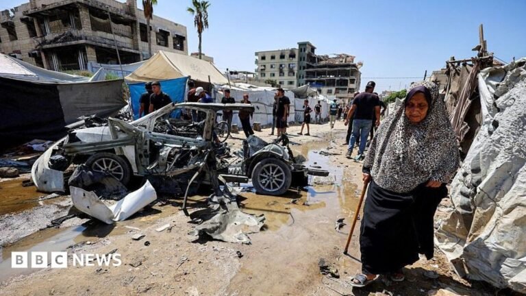 Israeli fire kills three in Gaza City during reported raid, medics say A woman with long brown hair looks at someone off-camera