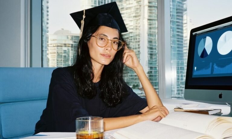 Business Analytics Skills and MBA Career Planning in South Florida A Female MBA graduate working on a business plan on her computer