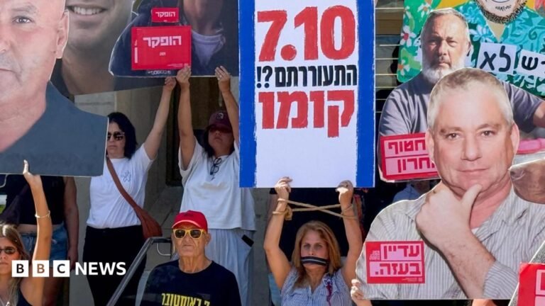 Israelis demand accountability over 7 October failures three years after attacks A woman comforts a mourner at a memorial ceremony for the community of Kibbutz Kfar Aza, on the third anniversary of the Hamas-led attack on Israel on 7 October 2023, in Kfar Aza, southern Israel (7 October 2026)
