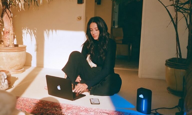Storing and Accessing Digital Information A female founder with a digital setup with her hard drive, laptop and smartphone