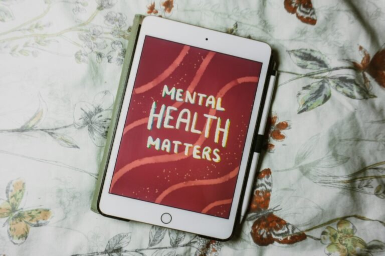 Survey aims to help improve mental health at work – Hull CC News A tablet resting on patterned bedding. On the tablet, white text on a red background reads 'mental health matters'