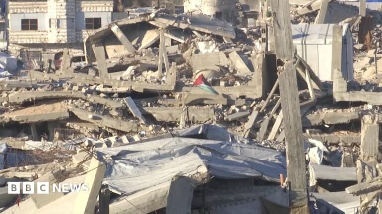 The situation in Gaza three years on A Palestinian flag flies in rubble in Gaza